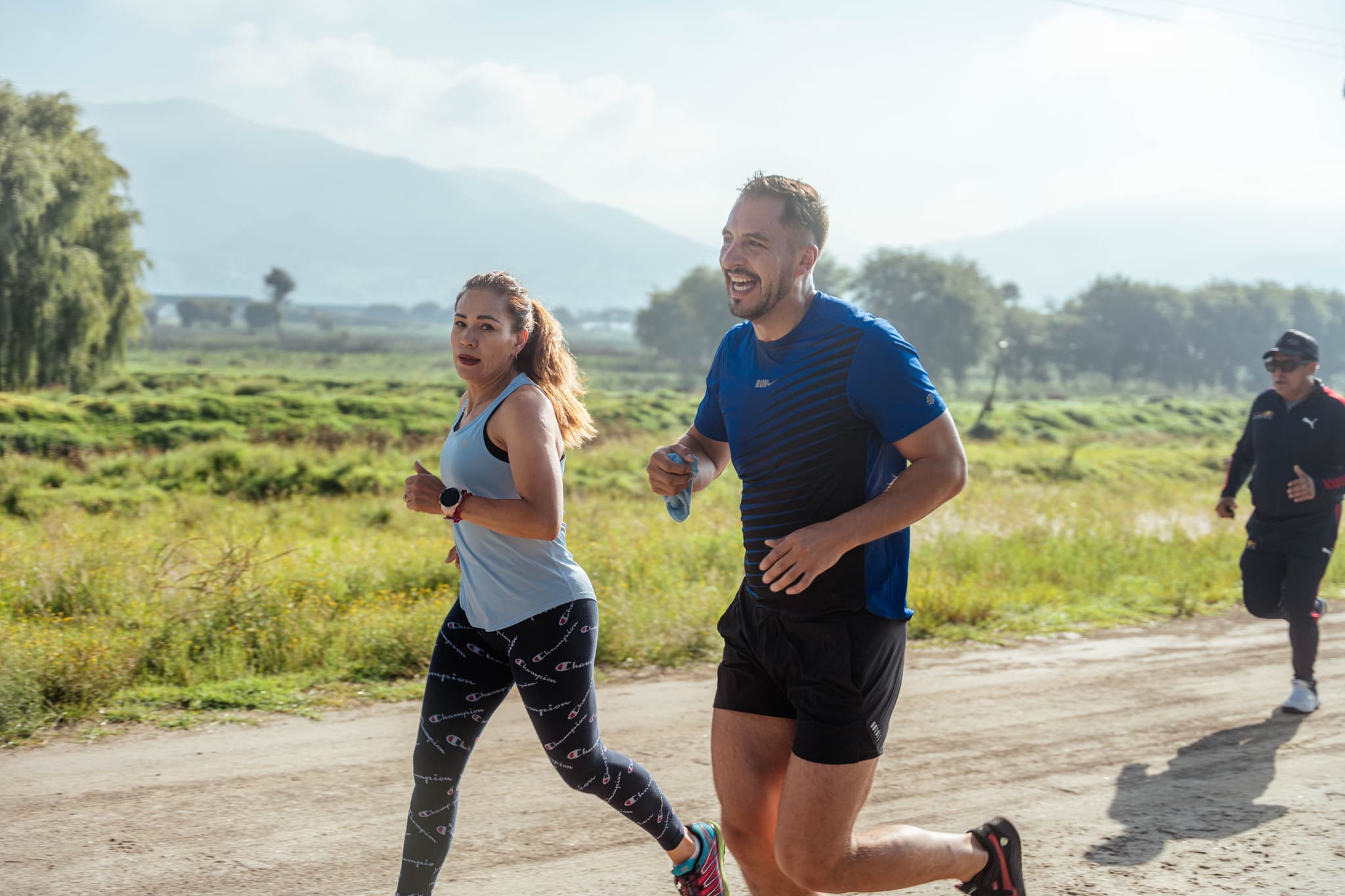 Two runners training together outdoors
