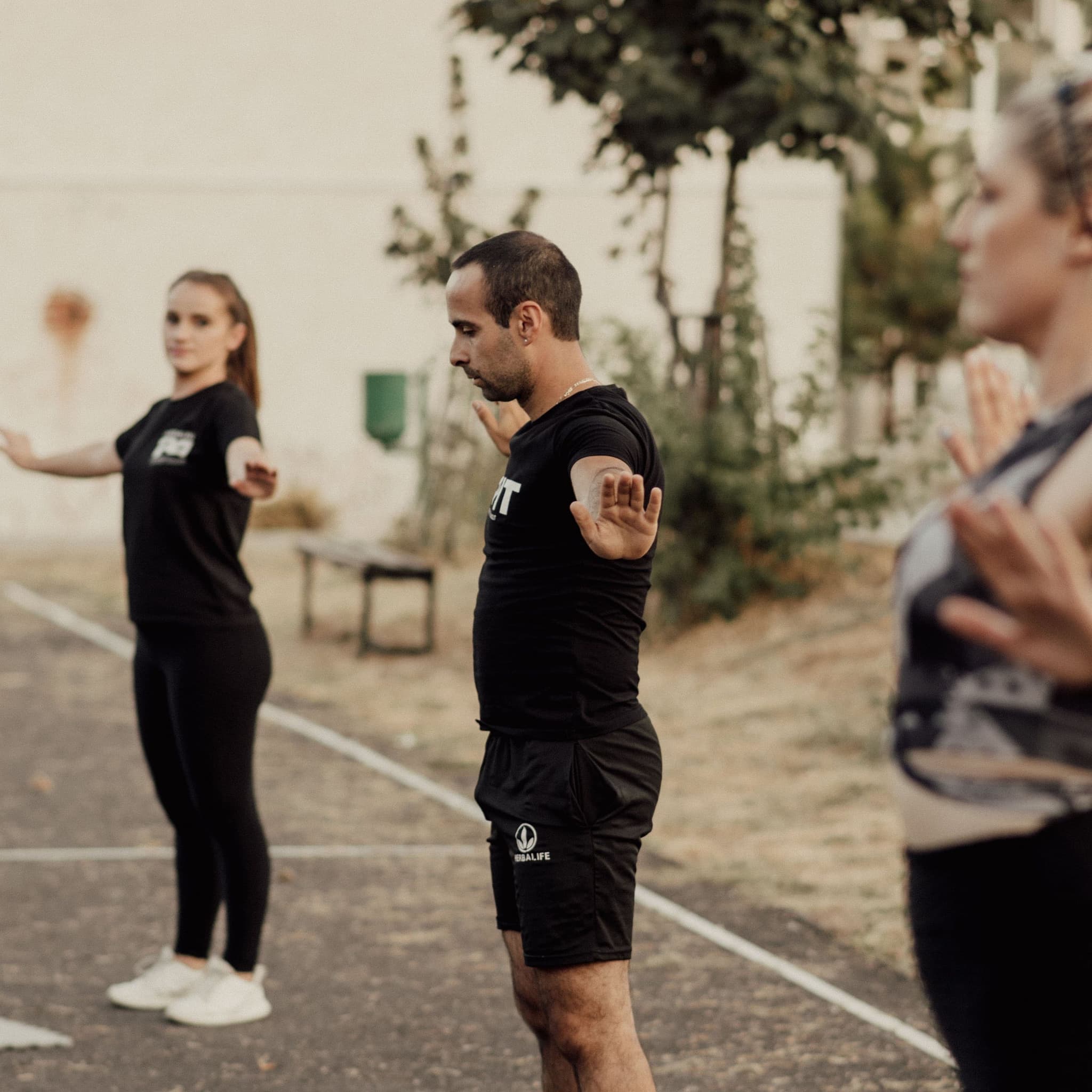 A coach leading a training session outdoors